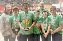 Pictured are from L to R: Coach and 4-H Educator Michelle Garwood, Kaden Garwood, Jaeden Garwood, August Wickman, Coach Andrew Utecht, Cash Jenkins, and Will Cox.