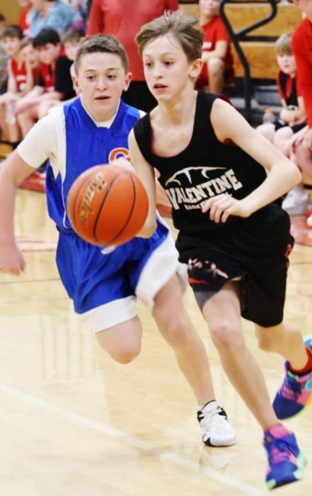 Sixth-grader Banks Beebout on a fast break in the Badgers game three of the Round Ball tournament against Gordon Rushville. Photo by Julie Liddy