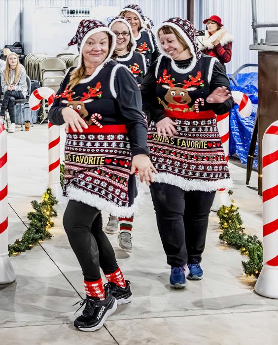 Girl Scout Troop 268 Leaders took the top spot in the Family Division of the Best Dressed Sweater Competition which was pretty sweet as they sashayed for the judges.