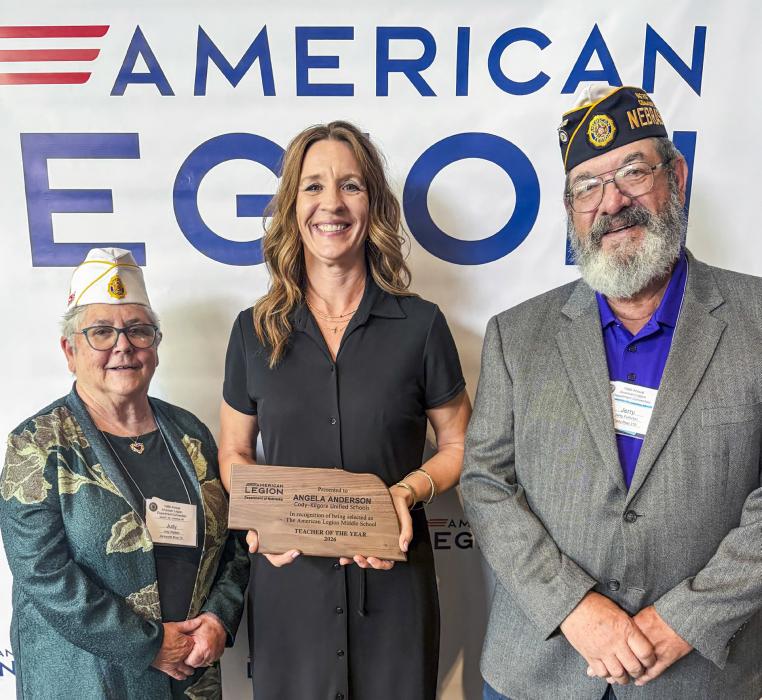 Pictured are from L to R: Nebraska State Commander Judy Walters, Teacher of the Year Angela Anderson, and Legion Post 319 Commander Jerry Fullerton.
