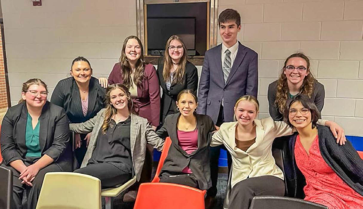 Speech team is pictured back row, L to R: Sari LaDeaux, Hope Woodraska, Praise Maunu, Landen Mooney, Camilla Brown. Front row, L to R: Jenalee Garwood, Marybelle Ward, Josie Shaul, River Doyle, and Anithia Red Bird.