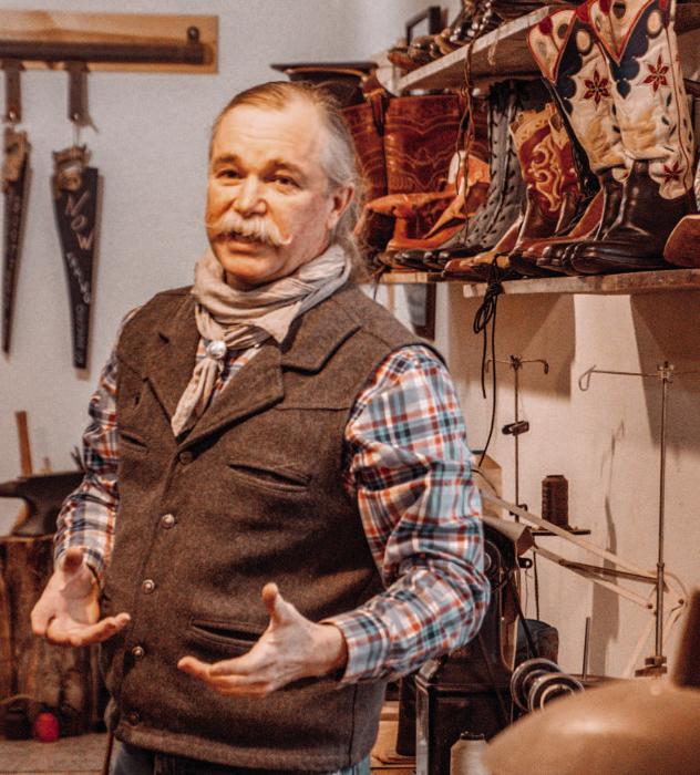 Kyle Rosfeld at Sandhills Boot Co. discussing some of his custom pieces.