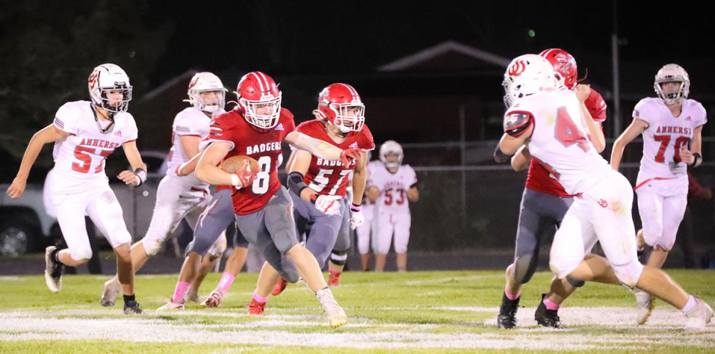 Parker Chavez is making a run for the Badgers against Amherst in the game held Friday, October 10, 2025. Photo by Nina Maria Nelson