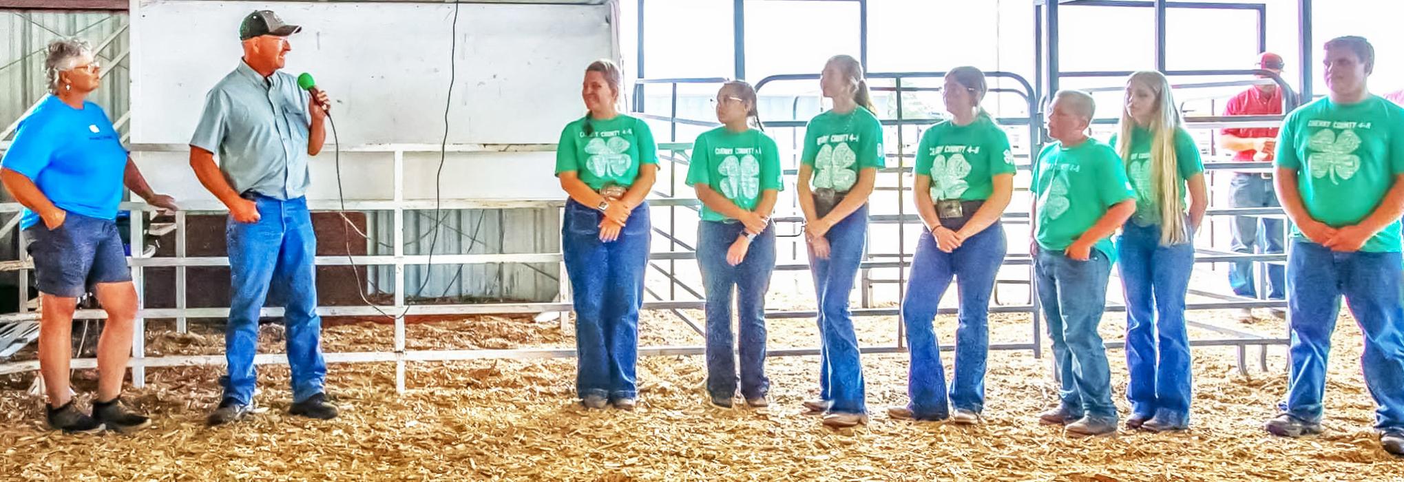 2025 Premier Exhibitor applicants and winner Mahaya Jones, pictured fourth from the right.