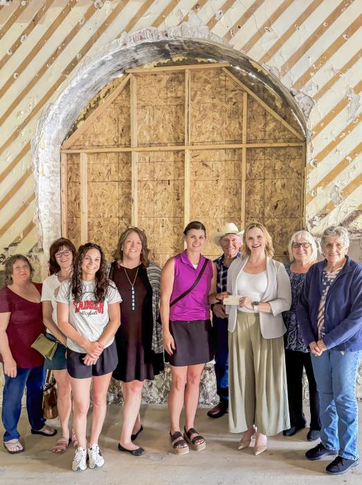 Pictured are from L to R: Sherri Britton, Jerilyn Colburn, Jaime Eggert, Regina Osburn, Danielle Arganbright, Ray Blackford, Jenny Moore, Nadeane Allard, and Joan Johnson.