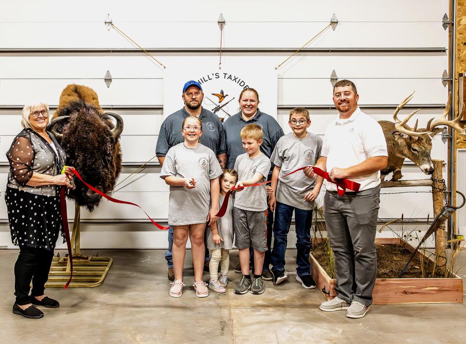 Pictured at Sandhills Taxidermy’s Ribbon Cutting are from L to R: Nadeane Allard, owners Brandon and Katie Ormesher, and Zane Limbach. Photo by Laura Vroman