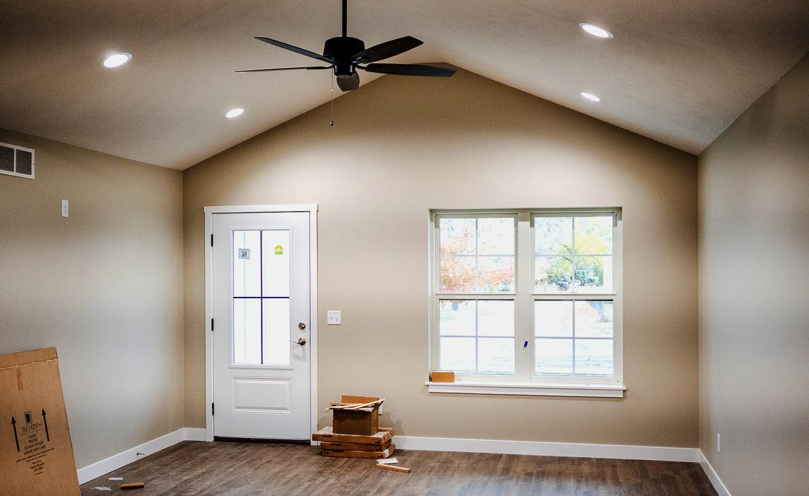 The living room features a vaulted ceiling, and the entire home has Anderson windows.
