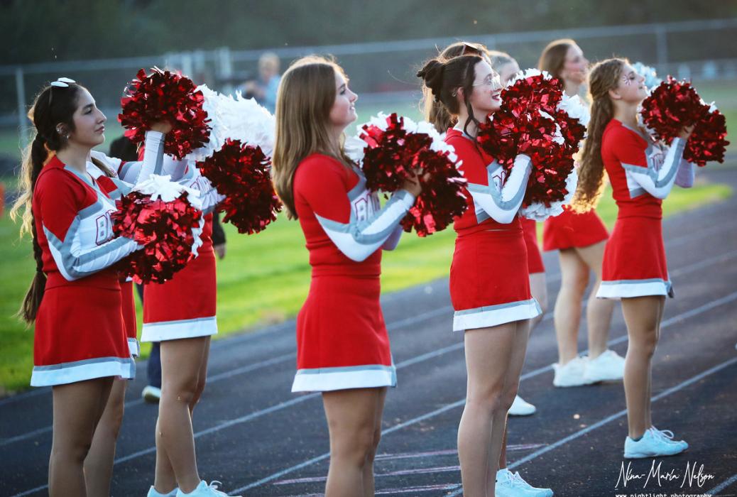 The cheer team leads the crowd to fire up the hometown crowd!