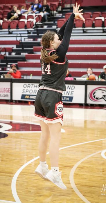 Devahney Belville shooting 3 points. Photo by Nina Maria Nelson
