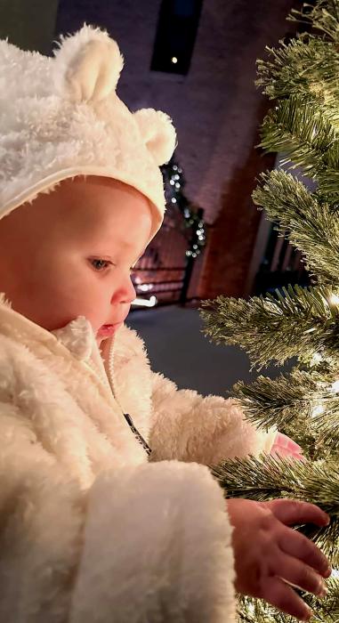 The wonder of her first Christmas is seen in the eyes of 10 month old Kooper Chytka, daughter of Bridger and Tessa Chytka, mom. Photo by Tessa Chytka