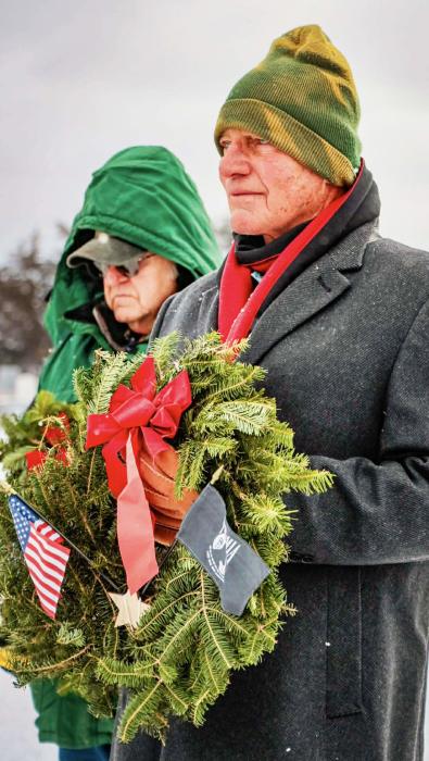 Don Nelsen holding the POW/MIA wreath and next to him was Bill Marshall holding the Merchant Marines Wreath Photo by Tina Boone