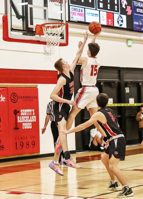 Isaac Cronin up for 2 surrounded by Broken Bow defenders. Photo by Nina Maria Nelsen