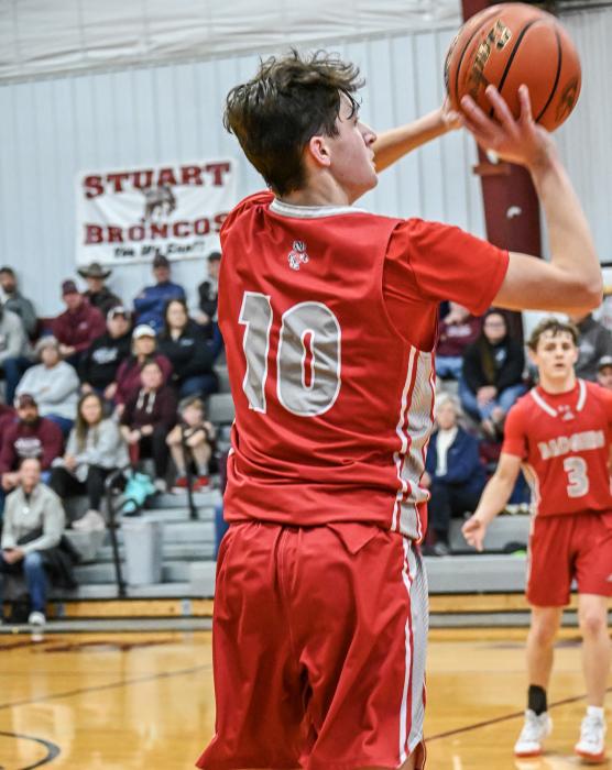 Junior Caden Stankoski puts up a shot during the Stuart game. Caden scored 11 points for the Badger’s victory. Photo by Harvey Dean Fast Horse