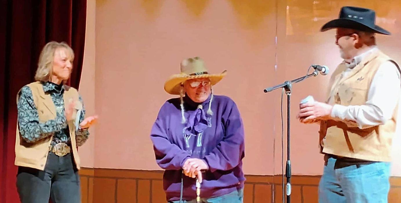 Eve Millar and Rick Bouy present Marie Condon, center, as the Surprise Guest at Old West Days. Photo by Jean Burge