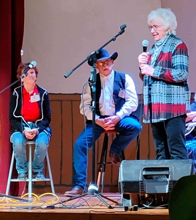 Long time poet, Yvonne Hollenbeck performs for attendees who came from far and wide to catch this year’s performances. Photo by Jean Burge