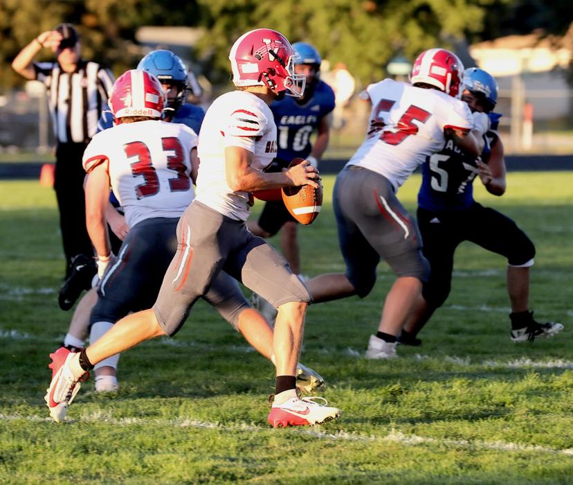 Tristen Beebout #3 looking for a pass as Cinch Miller #33 and Cooper Phillips #65 block the Eagles!