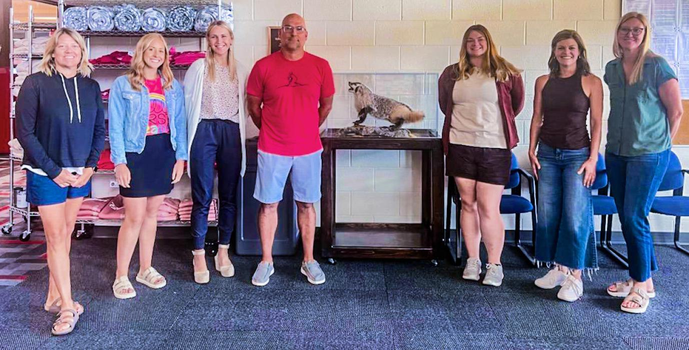 Pictured are from L to R: Krista Schoonveld, Elise Wheeler, Cappie (West) Harvey, Randy Kluender, Victoria Schwab, Nicole Hotz, and Kayla Markus.