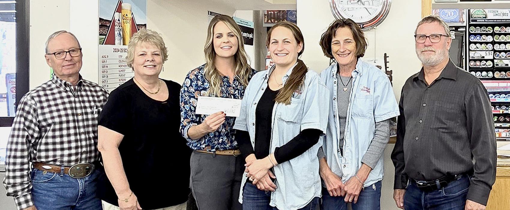 Pictured are from L to R: Sandhills Area Foundation board member Monty Neiffer, SAF Executive Director Carolyn Moore, board member Talia Benson, Samantha (Millard) Hand, Tammy Millard of Scotty’s, and board member Steve Brown receiving the first monthly check from the Round-Up for scholarships initiative which totaled $1,908.73 for the month of September. A grand total of $2,148.26 has been raised for students. Photo by Laura Vroman