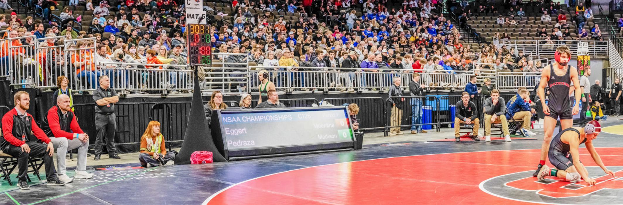 Valentine alumni showdown has Trent Osnes, second from the left, coaching against Markus Nelson. Both former VHS wrestlers who attended NSAA State.