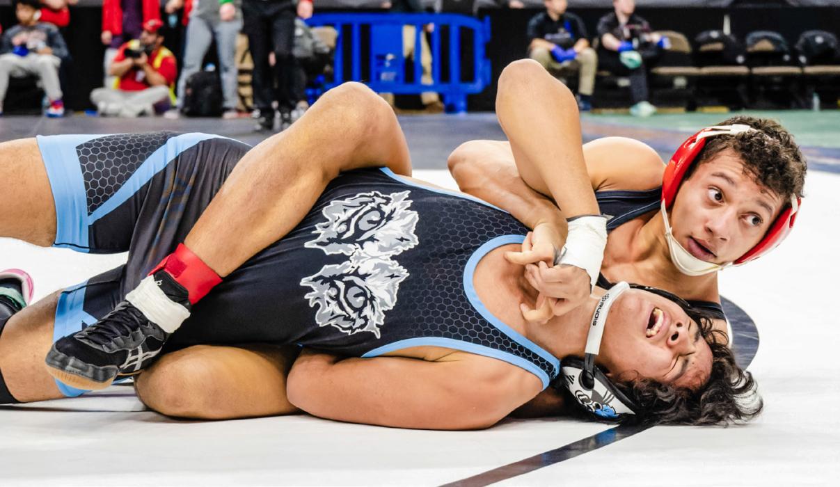 Jehki Williams, 132#, looks at the ref during the first round wrestle backs.