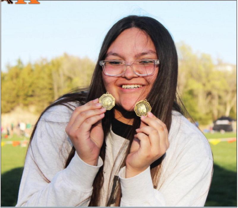 CK freshman Aubryanna Schmit shows off her medal haul from the Neligh-Oakdale Invite. Schmit broke the meet shot put record set in 1996 and beat her previous school shot put record by over one foot. Schmit also won the girls’ discus event at the Neligh-Oakdale Invite.