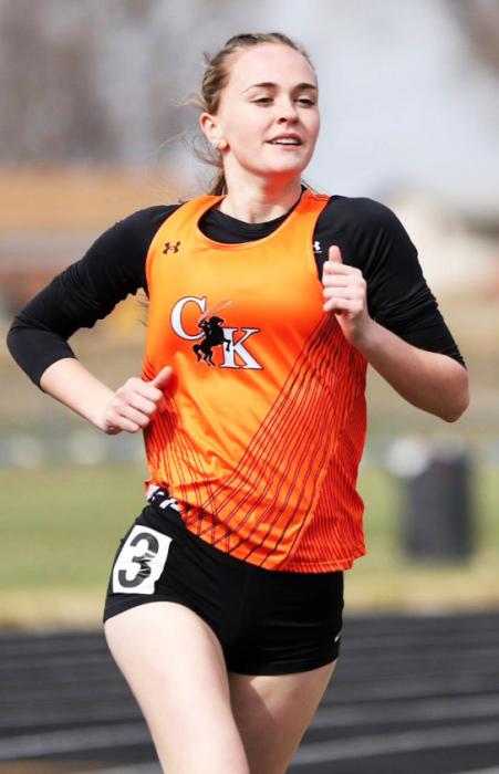 CK freshman, Lilly Ravenscroft, setting her pace to the 1600 meter run individual championship at the Alliance Invite. Photo courtesy Prep Running Nerd