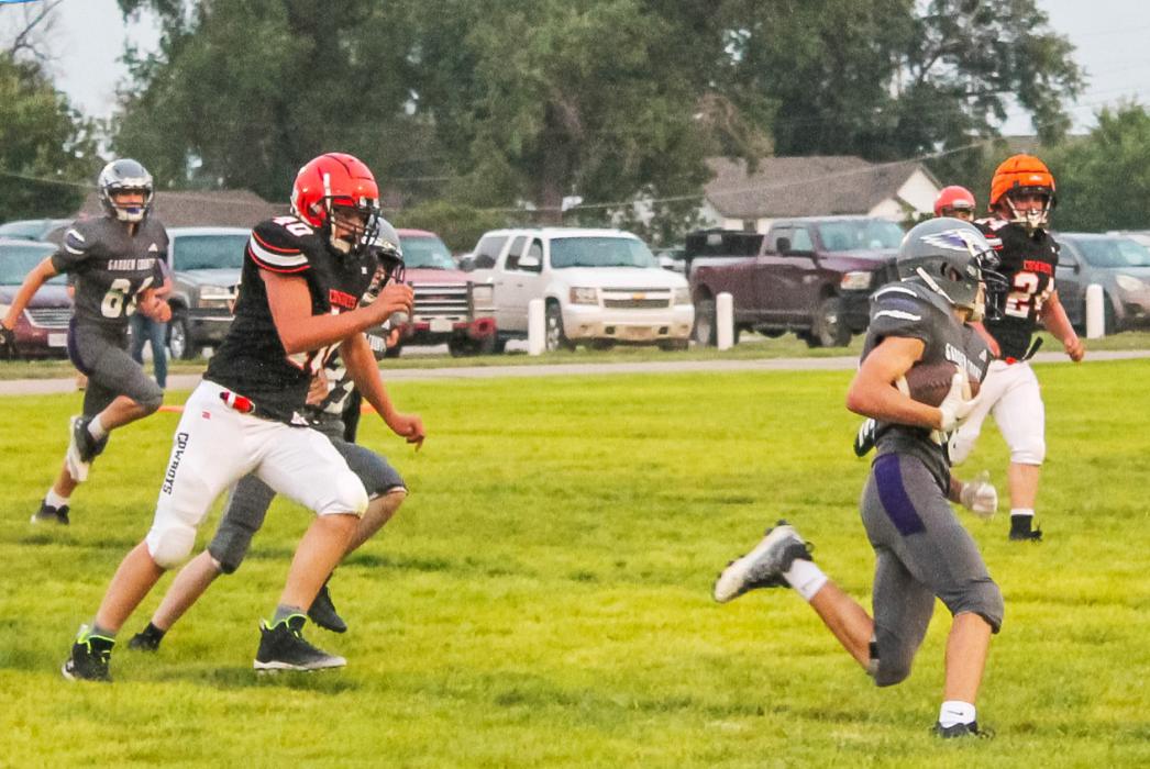 CK freshman Alex Barnes and CK junior Wesley Willert on hot defensive pursuit of an Eagle rusher against Garden County in Oshkosh, NE. The fourth-ranked Eagles defeated the Cowboys 52-15. Up next for the Cowboys was a Homecoming matchup against the Santee Warriors in Cody, NE, Friday, September 12, 2025. Photo by Kynzee McConaughey CKBeat