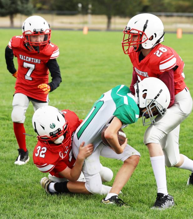 Sam Osborn #32 and Brantley Liddy #26 with the tackle. Maxx McSweeny #7, coming to help with the take down in the game played October 5, 2025.