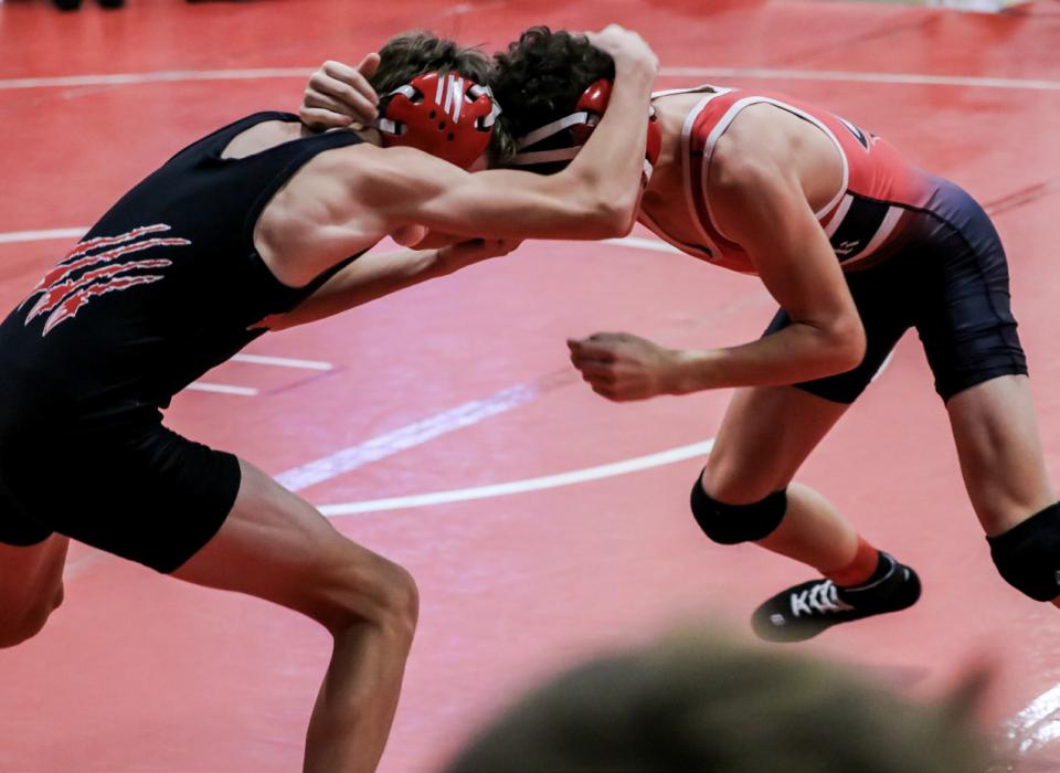 Deklin Titus ties up with his McCook opponent and gets the win and placed third at the Valentine Invitational.
