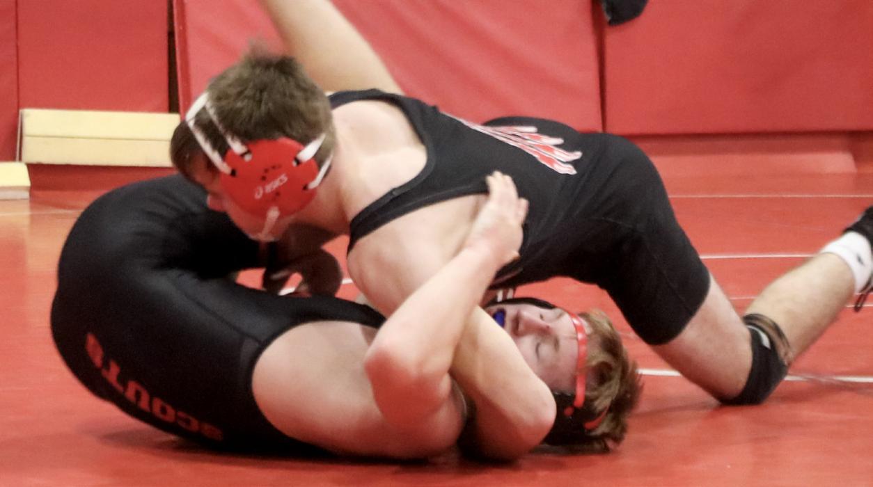 Trevor Burdick pins his David City opponents in the early rounds and places fourth at the Valentine Invitational.