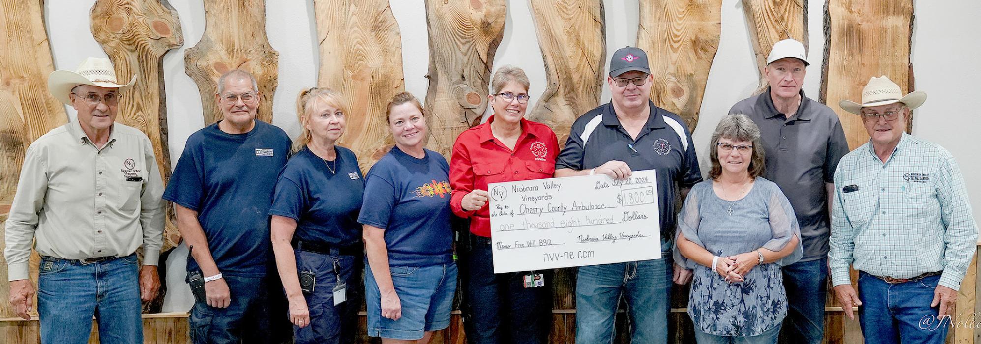 Pictured at left, from L to R: Tim Nollette, Steve Garwood, Kay Reese, Wendy Murphy, Christine Lousias, Duane Lamb, Shirley Kroeger, Doug Kroeger, and Greg Nollette who donated to Cherry County Ambulance.