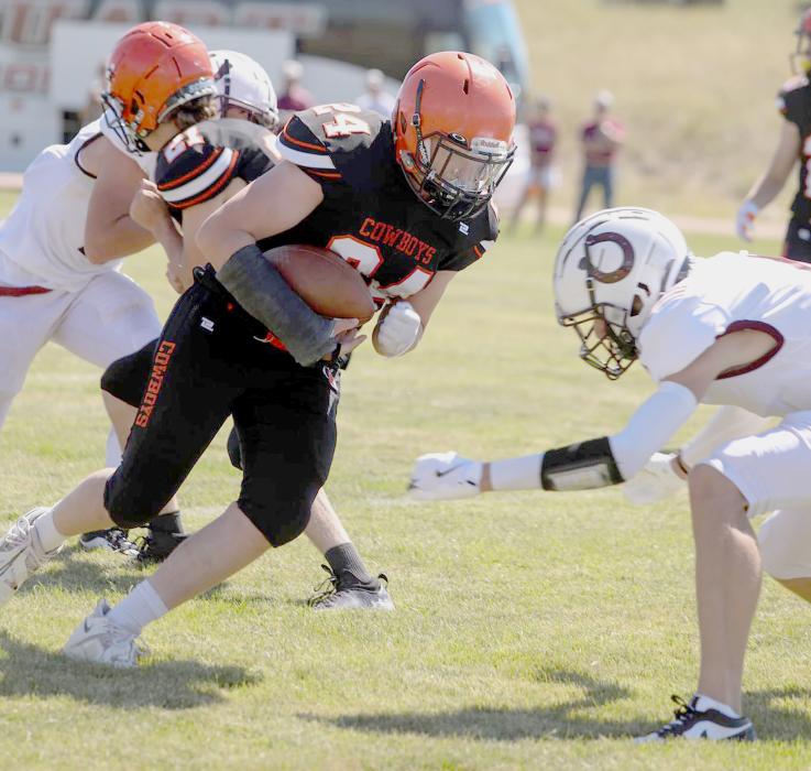 CK junior, Hesston Fay #24 meets a Stuart defender during action against the Broncos at Cody Athletic Park. Stuart won 46-20. Photos by Shontell Rosberry