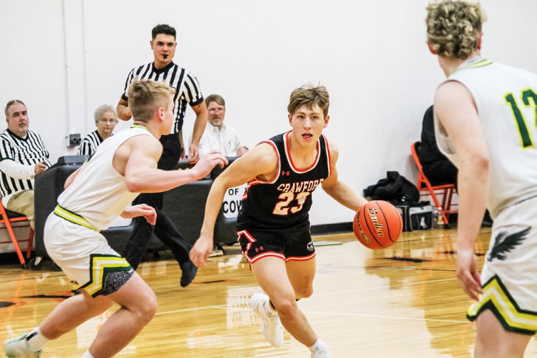 Crawford junior Taylor Homan on the drive during subdistrict basketball action versus Hay Springs. The Hawks defeated the Rams 62-37. Homan would surpass 1,000 career points, but his efforts were not enough to stop the Hawks, as Hay Springs would go on to win 64-60. Photo by Zoey Dorian