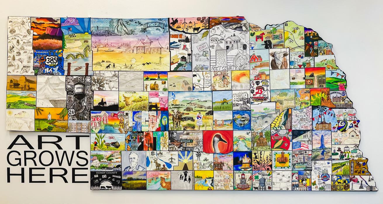 The art work for Cherry County was done by art students Jenalee Garwood, Talia Wenig, and Praise Maunu, who designed and finalized their creation depicting Cherry County and all it has to offer its residents and visitors last May.