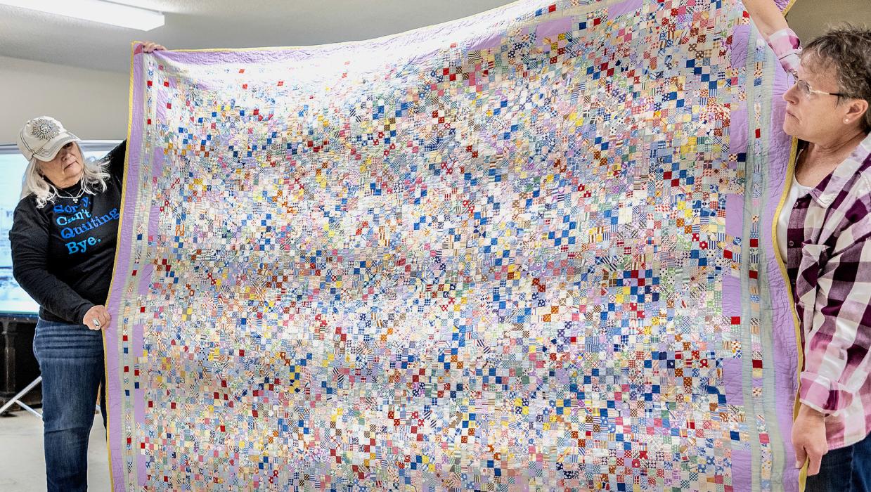 This four patch was made by Yvonne’s aunt. It just so happened that Yvonne also has that aunts journal where she wrote that she had worked on her “purple quilt.” It wasn’t like they could go buy yards of purple fabric at the store, instead the purple was used in the borders. Photos by Laura Vroman