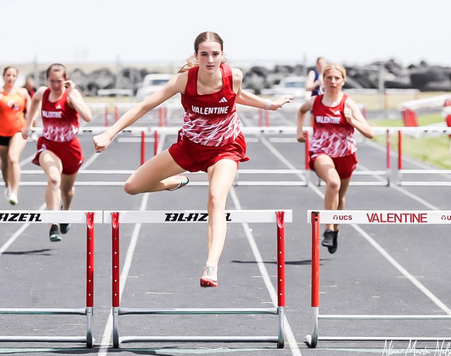 Paige Sprenger earns first place in hurdles.