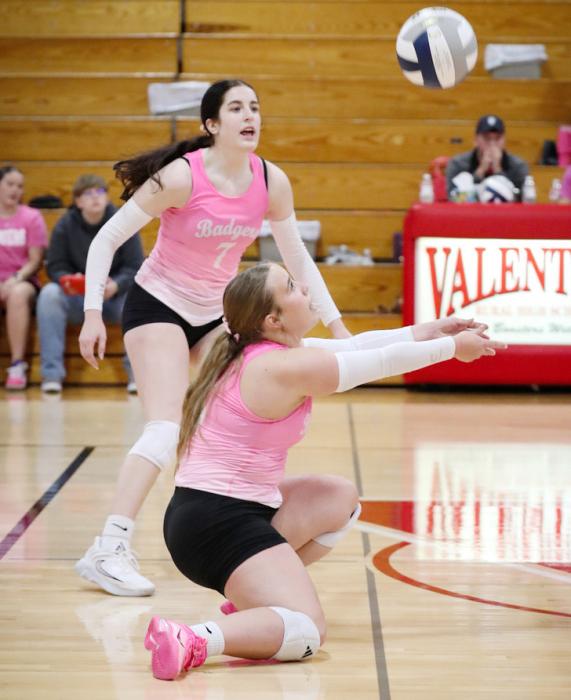 Junior Tygh Miller passing the ball to Senior Ashlyn Hutchinson against Hyannis.