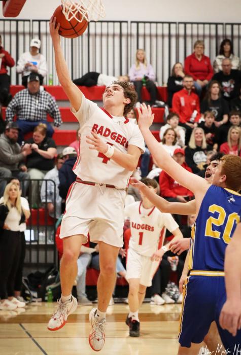 Junior Dominic Beebout lay up in the game against the Huskies. Photos by Nina Maria Nelson