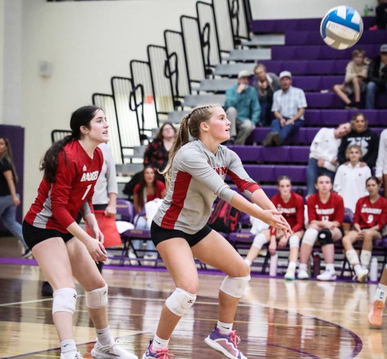 Above, Danika Janssen, libero, passes the ball. Below, Davani Bellville sets the ball in the game against Martin, SD. Photos by Nina-Maria Nelson