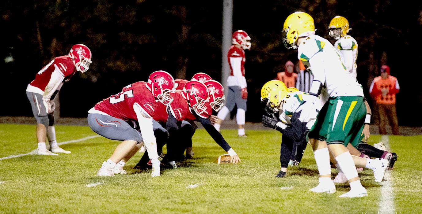 Center John Fulton #56 ready to snap the ball.