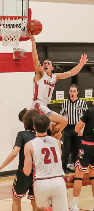 Pictured at left is Isaac Cronin #15 with a dunk. Pictured above is Andon Olson #1 with a lay up. He was recognized for reaching 1,000 career points! Photos by Nina-Maria Nelson