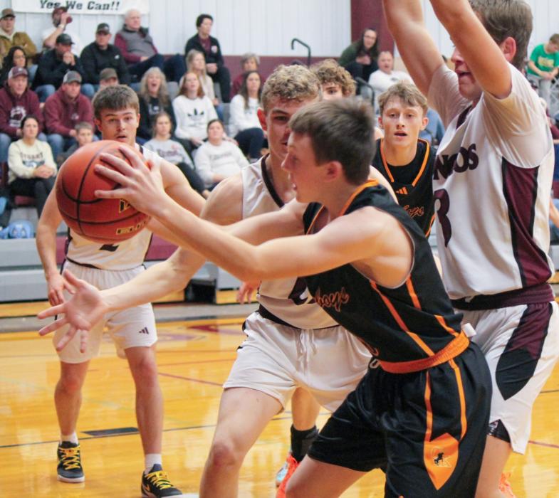 CK freshman Bentley Ford #0 surrounded by Bronco defenders as senior Cash Cooper #3 looks on in action against Stuart. Photo by Kynzee McConaughey