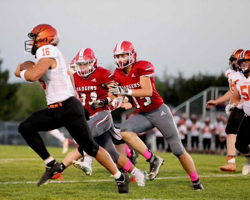Seniors Cinch Miller #33 and Quinton Nelson #75 in pursuit of a Tiger. Photos by Nina Maria Nelson