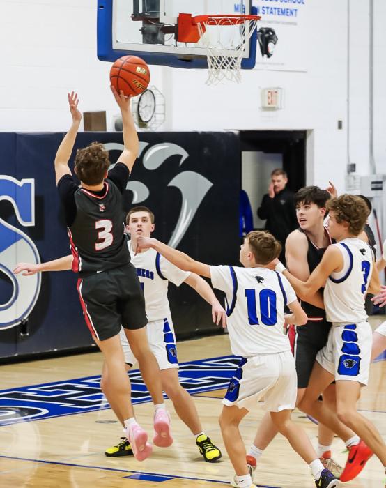 Valentine’s Trystan Beebout goes up for points in the game against Hershey.