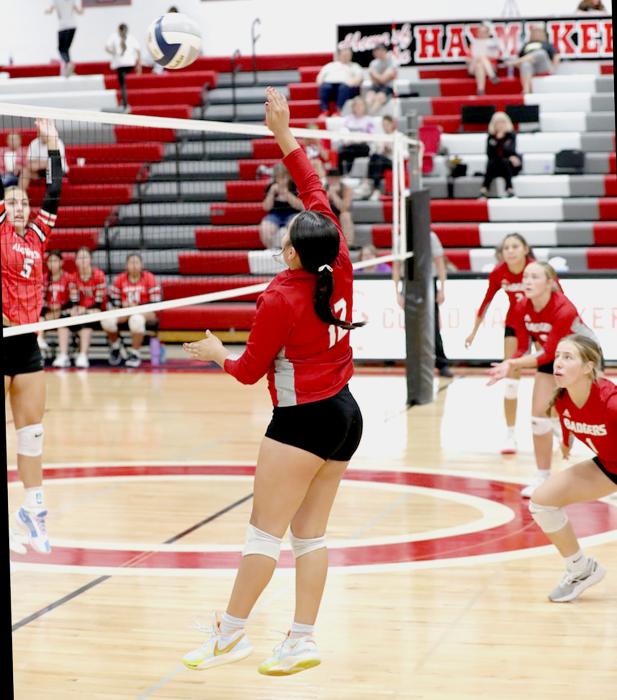 Olena Felton #12 spiking on the outside in the game against Ainsworth.