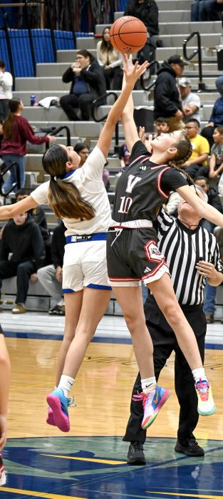 Maeli Patterson #10 gets the upper hand at the tipoff.