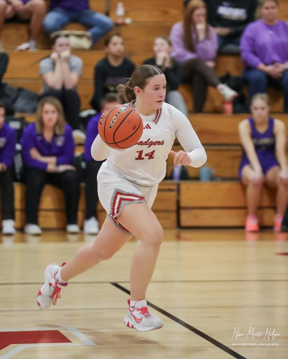 Senior Kimber McGinley #14 setting up offense in the game against Holdrege. Photo by Nina Maria Nelson