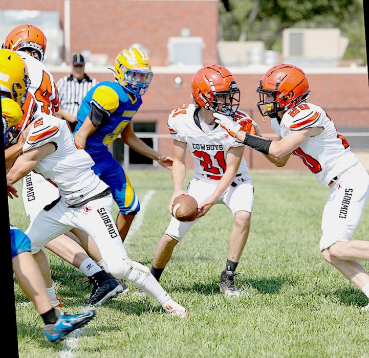 The Cowboys were on the road for the first time this season Friday, September 13, 2024, coming home with a victory over the Santee Warriors, with a final score of 78-31. Jasper Roseberry #21 fakes the handoff to Brady Skinner #20.
