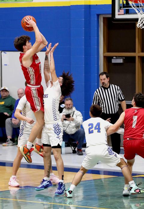 Isaac Cronin #15 with a jump shot in the game at Todd County. He scored 27 points in the game.
