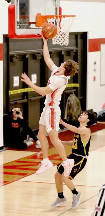 Trystan Beebout #3 goes for a layup in the win over Mullen. Photos by Nina Maria Nelson